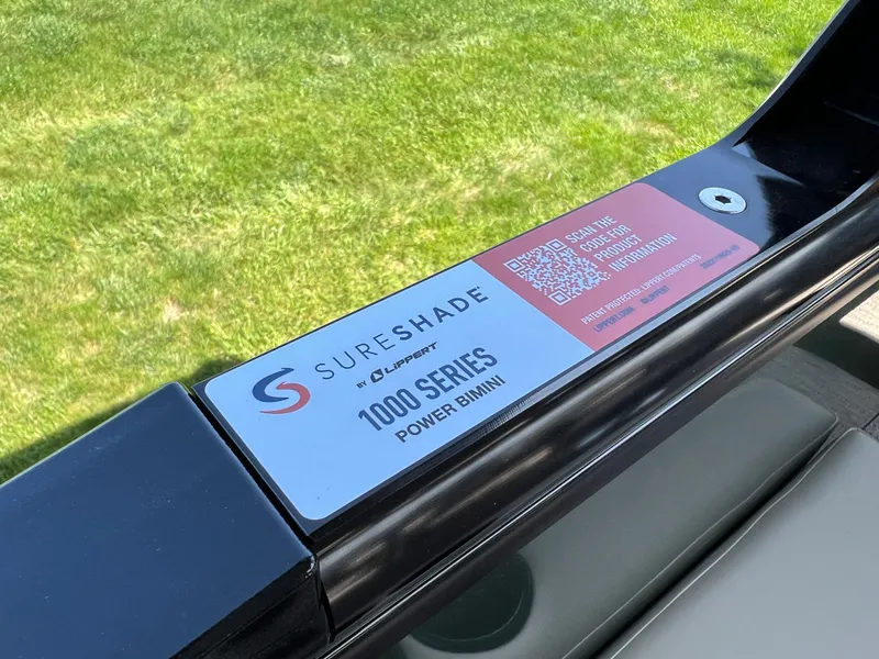 Slide: The Image of SureShade 1000 Series Power Bimini label on Godfrey Sweetwater 2286 Quad Social Tri-Toon, 2025 model. - 24