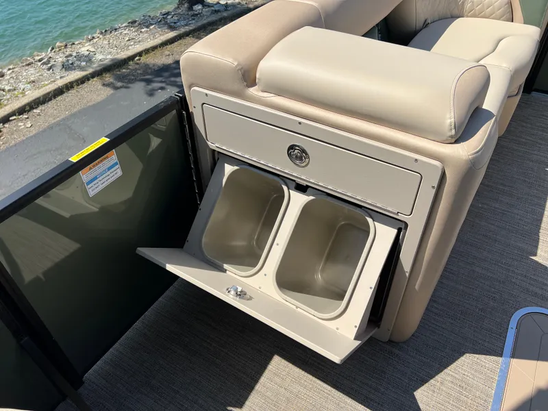 Slide: The Image of Luxurious seating with built-in storage on 2025 Godfrey Sweetwater 2286 Quad Social Tri-Toon. - 26