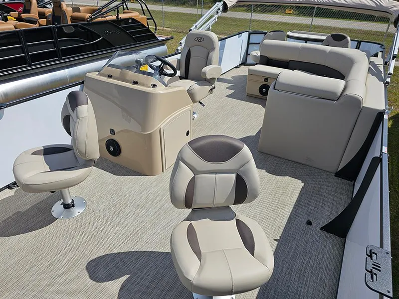Slide: The Image of 2025 Bentley Pontoons 240 4-Point Fish interior with beige seating and steering console. - 11
