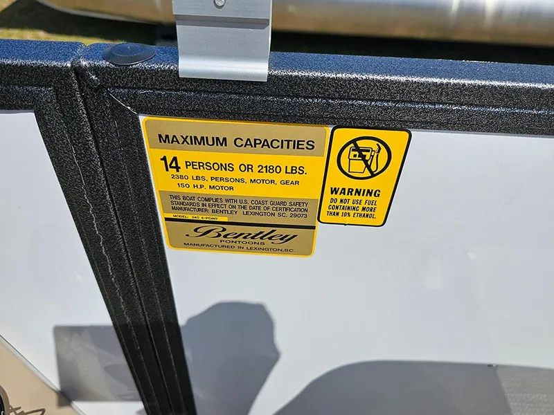 Slide: The Image of 2025 Bentley Pontoons 240 4-Point Fish capacity label, 14 persons or 2180 lbs limit. - 18