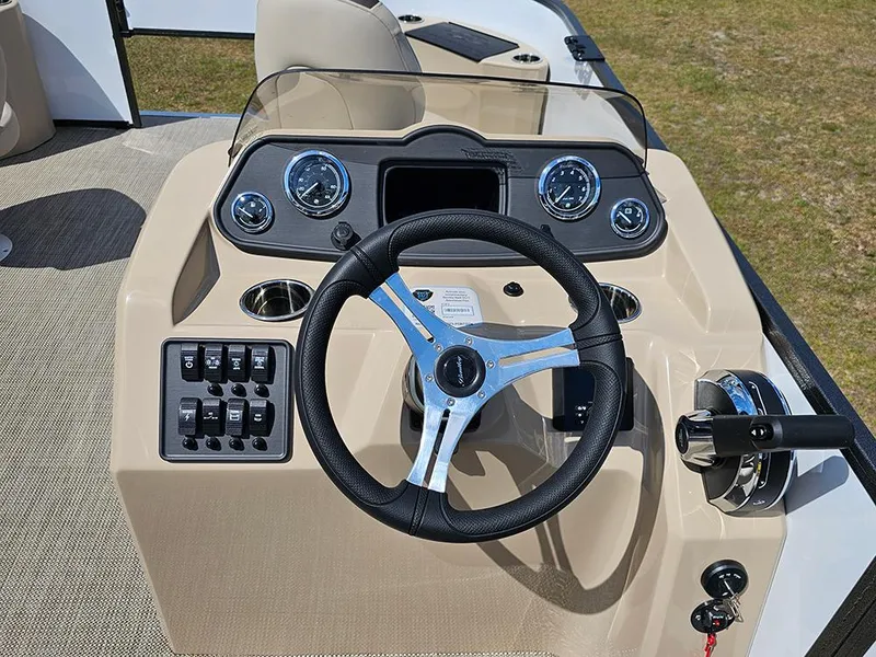 Slide: The Image of 2025 Bentley Pontoons 240 4-Point Fish dashboard with steering wheel and controls. - 19