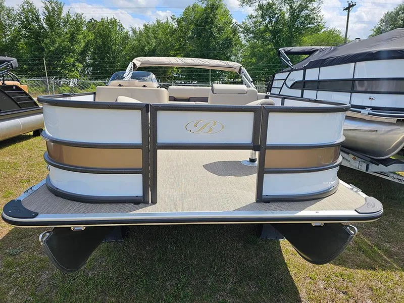 Slide: The Image of 2025 Bentley Pontoons 240 4-Point Fish boat, rear view, parked on grass. - 4