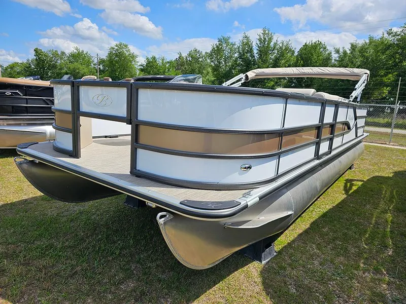 Slide: The Image of 2025 Bentley Pontoons 240 4-Point Fish on grass under blue sky. - 5