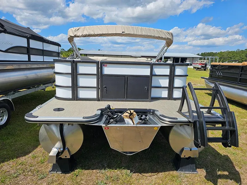 Slide: The Image of 2025 Bentley Pontoons 240 4-Point Fish pontoon boat displayed outdoors under a blue sky. - 7