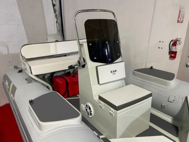Slide: The Image of 2024 ZAR Mini RIB 15 Tender boat interior with seating and control console. - 3
