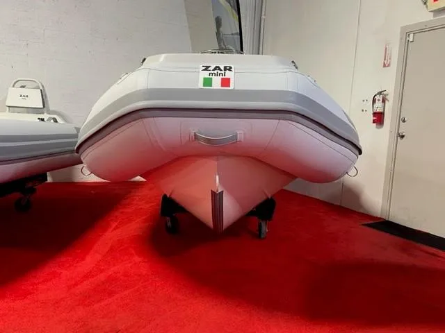 Slide: The Image of 2024 ZAR Mini RIB 15 Tender on red carpet in showroom. - 5