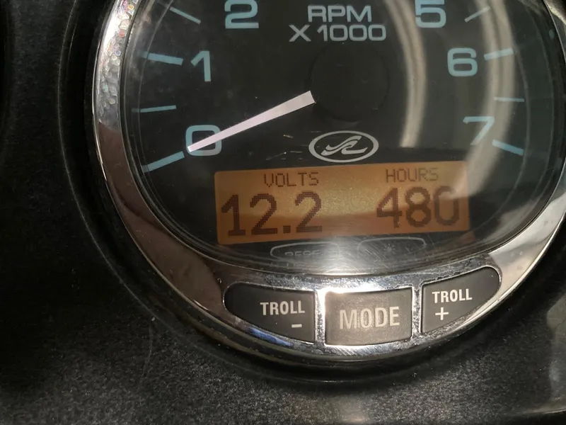 Slide: The Image of Close-up of 2005 Sea Ray 220 Select gauge showing 12.2 volts and 480 hours. - 13