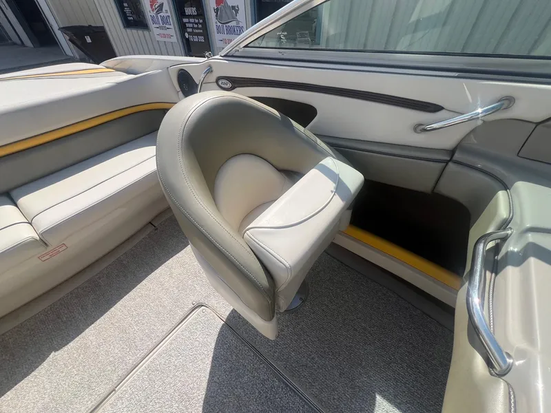 Slide: The Image of Interior of a 2005 Sea Ray 220 Select boat, featuring plush seating and sleek design. - 16