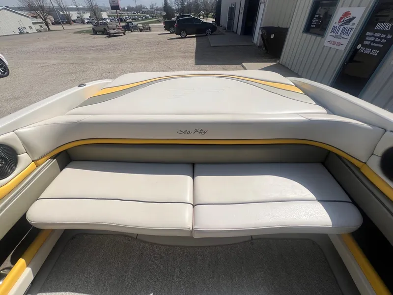 Slide: The Image of 2005 Sea Ray 220 Select boat interior with beige and yellow seating. - 20