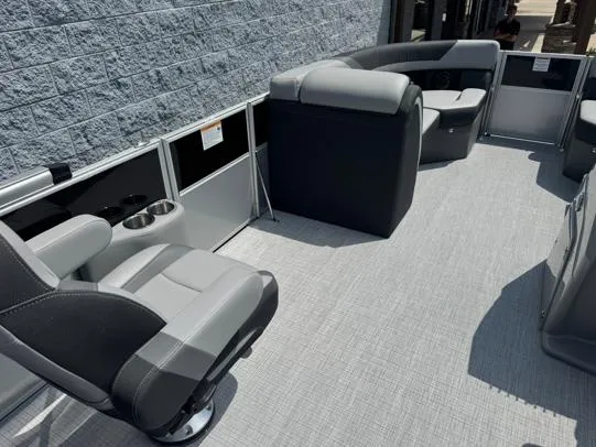 Slide: The Image of 2025 South Bay S224RS pontoon boat interior with gray seating and modern design. - 6