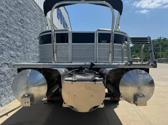 Slide: The Image of 2025 South Bay S224RS pontoon boat, rear view, parked on concrete surface. - 9