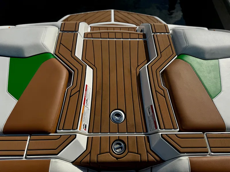 Slide: The Image of 2017 Nautique Super Air Nautique GS20 boat deck with brown and green accents. - 11