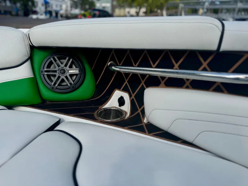 Slide: The Image of 2017 Nautique Super Air Nautique GS20 interior with speaker and cup holder detail. - 13