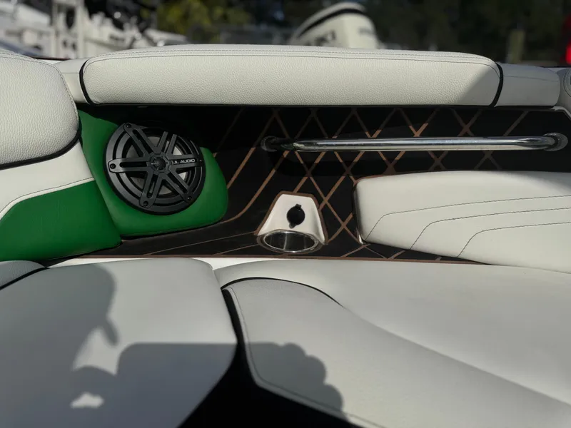 Slide: The Image of 2017 Nautique Super Air Nautique GS20 interior with speaker and cup holder. - 19