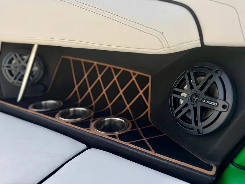 Slide: The Image of 2017 Nautique Super Air Nautique GS20 interior with speakers and cup holders. - 8