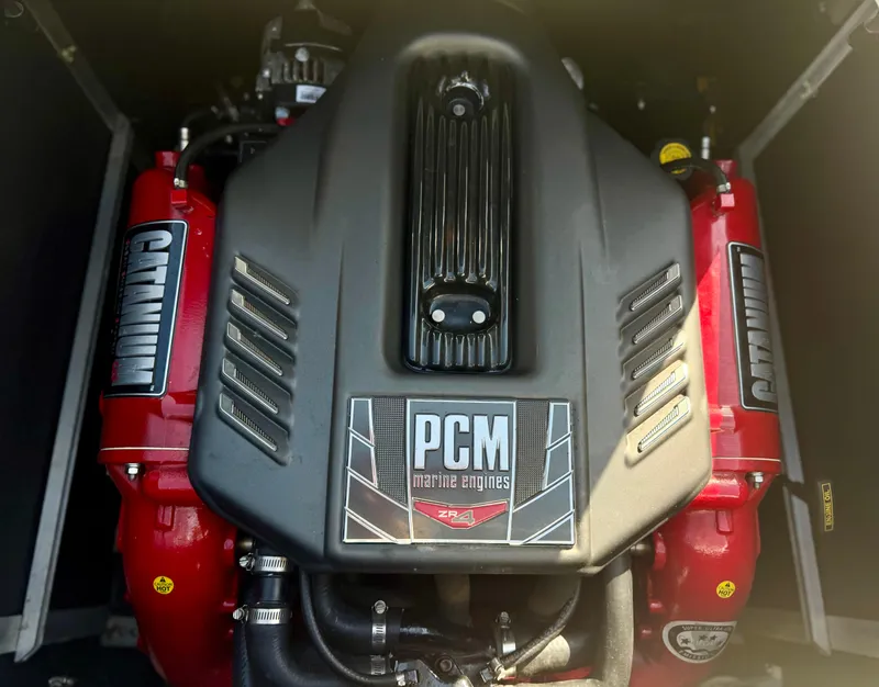 Slide: The Image of Engine of 2017 Nautique Super Air Nautique GS20 with PCM Marine branding. - 9