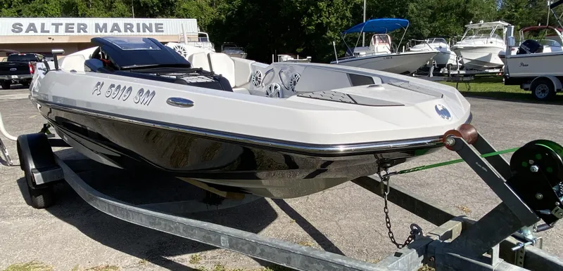 Slide: The Image of 2018 Scarab 165 boat on trailer at Salter Marine dealership. - 3