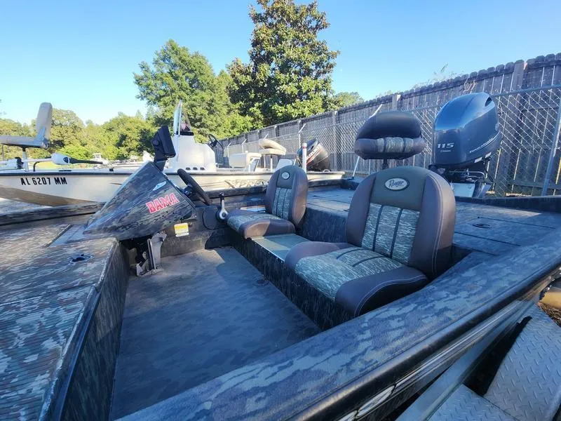 Slide: The Image of 2015 Ranger Tournament RT188 boat with camo seats and powerful outboard motor. - 10
