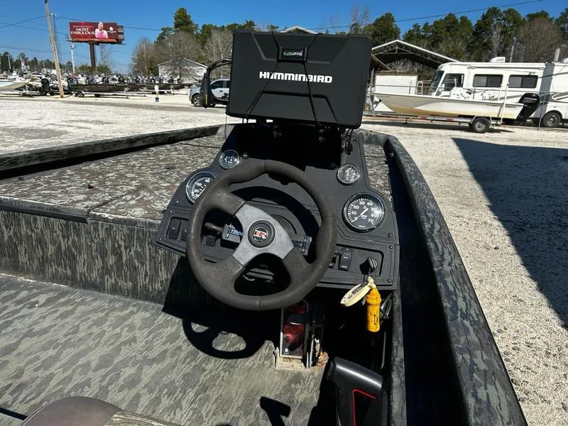 Slide: The Image of 2015 Ranger Tournament RT188 boat dashboard with Humminbird fish finder and steering wheel. - 13