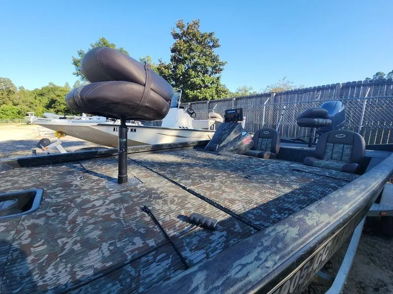 Slide: The Image of 2015 Ranger Tournament RT188 boat with camo design, parked outdoors. - 14