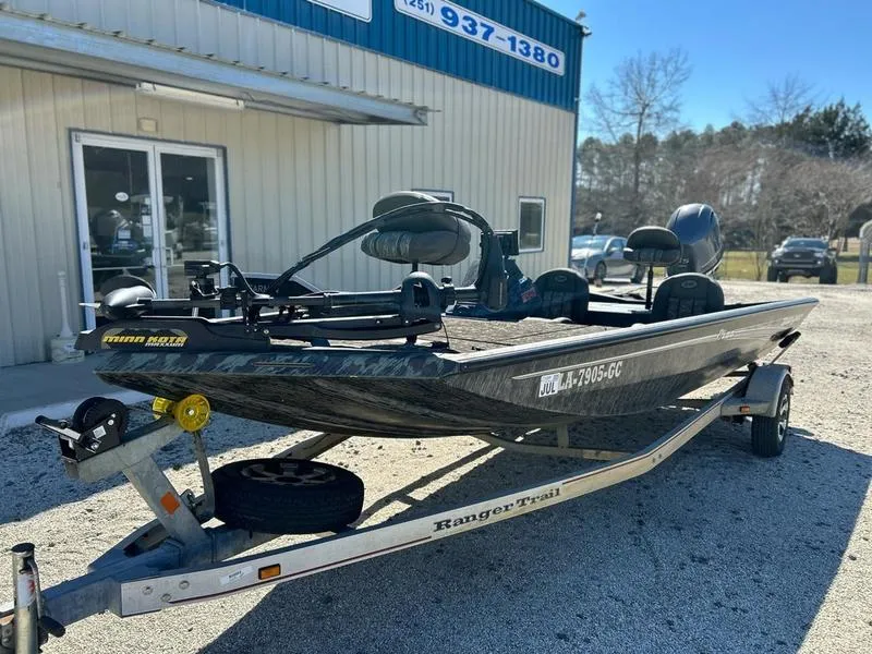 Slide: The Image of 2015 Ranger Tournament RT188 boat on trailer outside a building. - 2