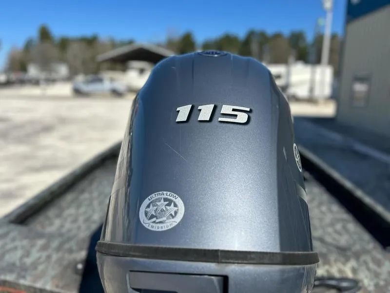 Slide: The Image of Outboard motor with "115" label on a 2015 Ranger Tournament RT188 boat. - 22