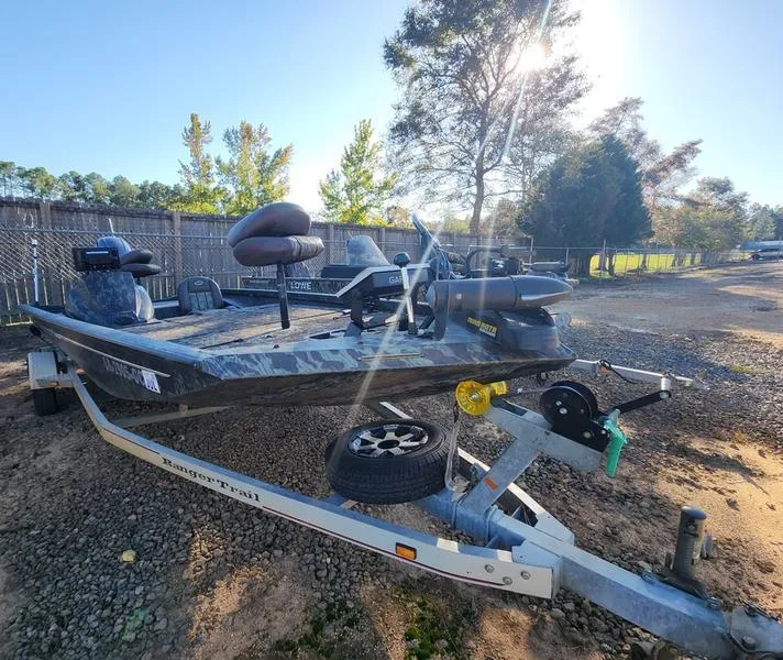 Slide: The Image of 2015 Ranger Tournament RT188 fishing boat on trailer in outdoor setting. - 3