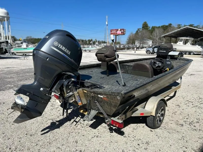 Slide: The Image of 2015 Ranger Tournament RT188 boat with Yamaha motor on a trailer in a sunny outdoor setting. - 4