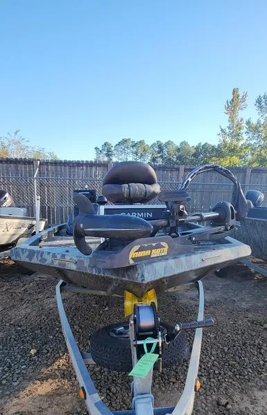 Slide: The Image of 2015 Ranger Tournament RT188 boat on trailer, equipped with Garmin electronics, parked outdoors. - 5