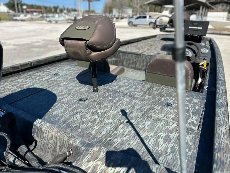 Slide: The Image of 2015 Ranger Tournament RT188 boat interior with camo design and brown seating. - 8