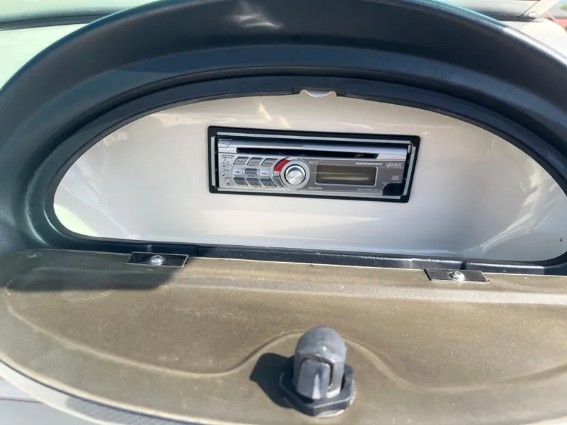 Slide: The Image of 2008 Sea Ray 205 Sport boat stereo system in dashboard compartment. - 17