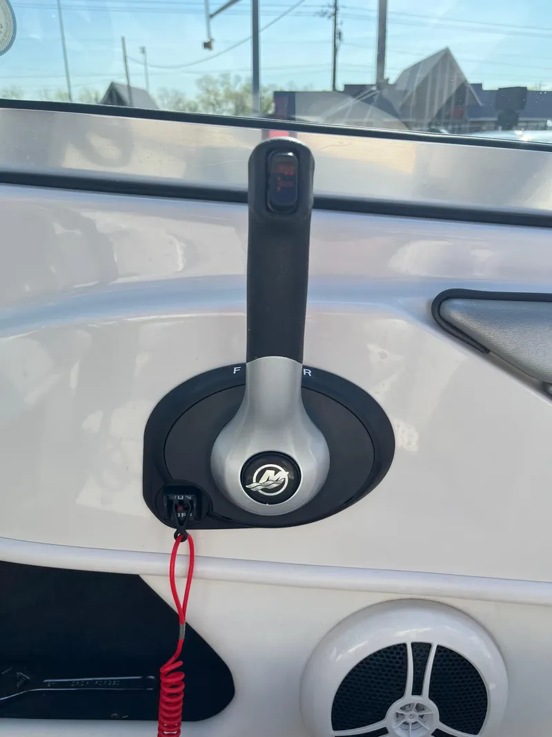 Slide: The Image of Throttle control of a 2008 Sea Ray 205 Sport boat with safety lanyard. - 18