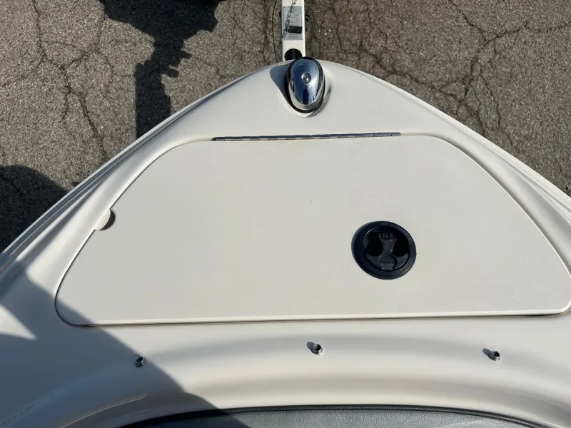 Slide: The Image of 2008 Sea Ray 205 Sport boat bow with hatch and cleat on pavement. - 3