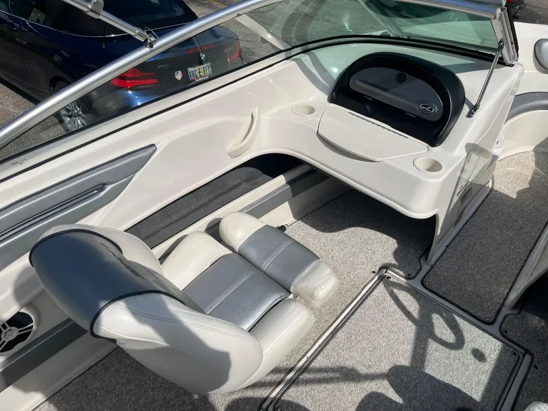 Slide: The Image of Interior of a 2008 Sea Ray 205 Sport boat with seating and dashboard. - 9