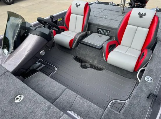 Slide: The Image of 2025 Phoenix 919ZXL boat interior with red and gray seats, steering console, and carpeted flooring. - 4