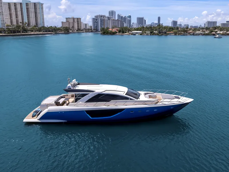 The Image of Luxury 2012 Cheoy Lee 76 Alpha yacht on calm blue water, city skyline background. - 0