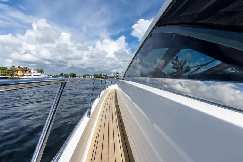 Slide: The Image of 2012 Cheoy Lee 76 Alpha yacht with sleek deck and scenic water view. - 15