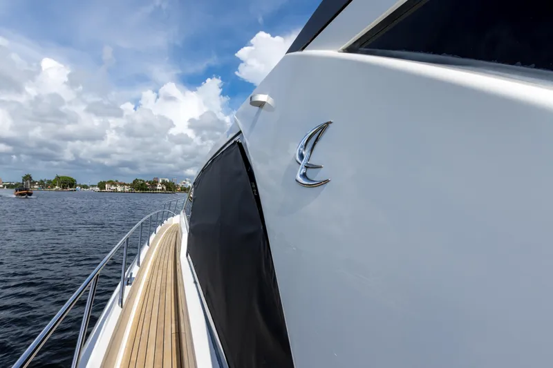 Slide: The Image of 2012 Cheoy Lee 76 Alpha yacht on water, showcasing sleek design and luxury features. - 16