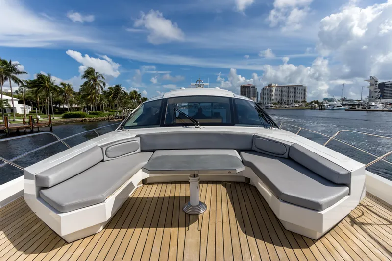 Slide: The Image of Luxurious 2012 Cheoy Lee 76 Alpha yacht deck with seating, overlooking marina and skyline. - 19