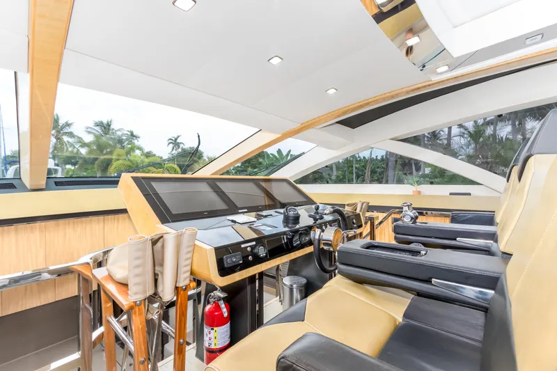 Slide: The Image of Luxurious 2012 Cheoy Lee 76 Alpha yacht helm with modern controls and plush seating. - 25