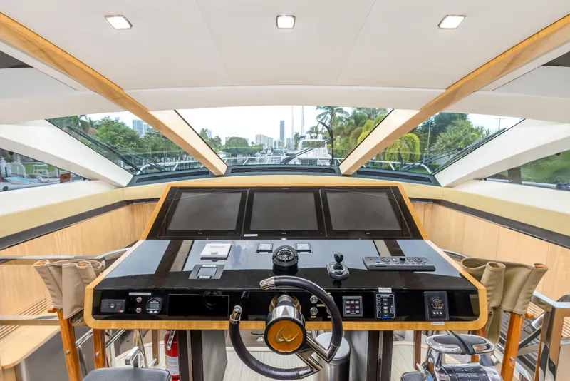 Slide: The Image of Helm of 2012 Cheoy Lee 76 Alpha yacht with modern navigation equipment and panoramic windows. - 26
