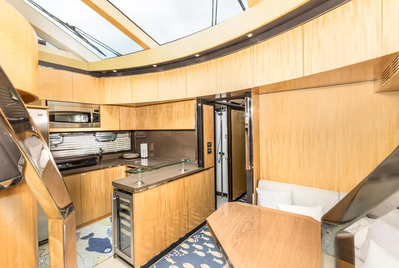 Slide: The Image of Luxurious interior of 2012 Cheoy Lee 76 Alpha yacht with modern kitchen and seating area. - 29