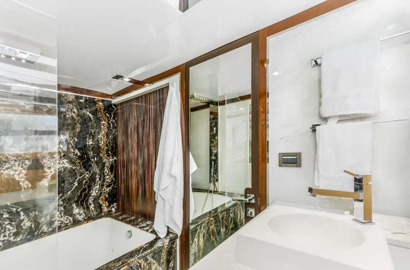 Slide: The Image of Luxurious bathroom in 2012 Cheoy Lee 76 Alpha yacht with marble accents and modern fixtures. - 39