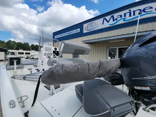 Slide: The Image of 2021 Avid 21 FS boat at L&M Marine dealership, featuring a four-stroke engine. - 13