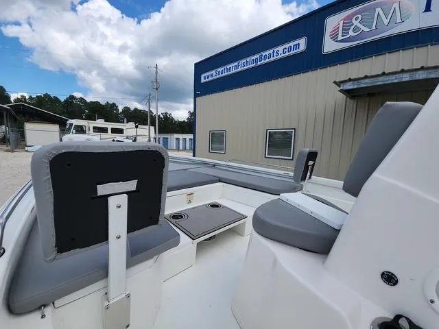 Slide: The Image of 2021 Avid 21 FS boat interior with gray seating, near Southern Fishing Boats building. - 20