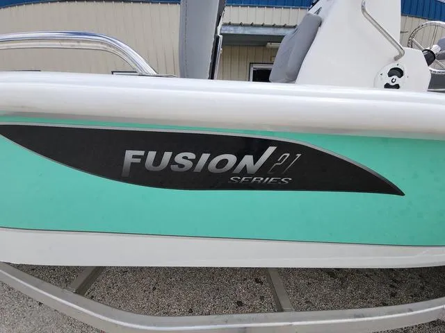 Slide: The Image of Avid 21 FS Fusion Series boat, 2021 model, with teal and black detailing. - 3