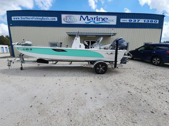 Slide: The Image of 2021 Avid 21 FS boat on trailer outside I&M Marine LLC building. - 4