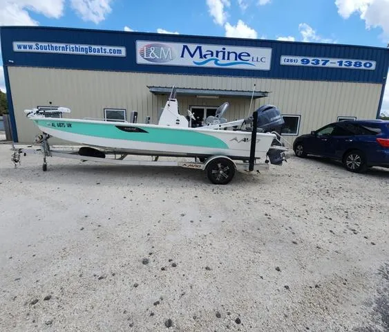 Slide: The Image of 2021 Avid 21 FS boat parked outside I&M Marine LLC building. - 8