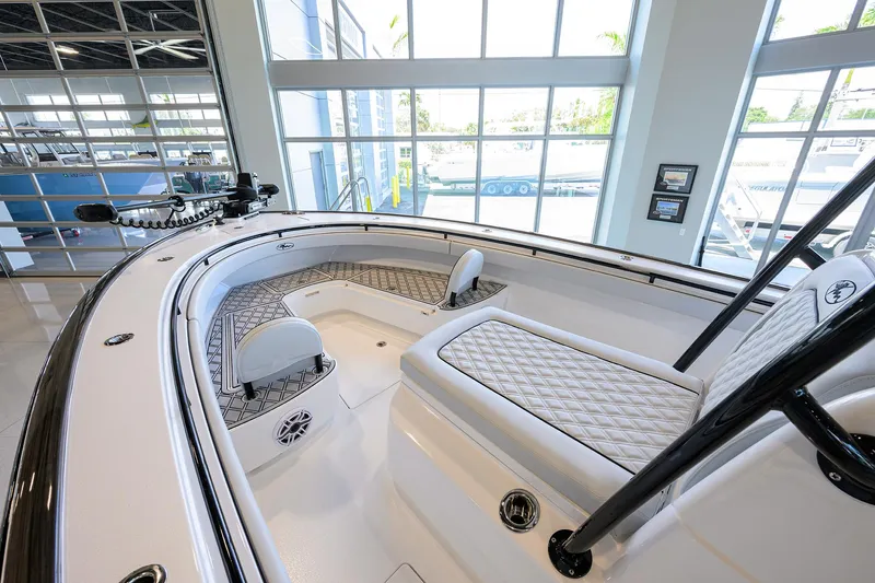 Slide: The Image of 2025 Valhalla Boatworks V-29 interior, showcasing sleek design and luxurious seating in a showroom. - 13