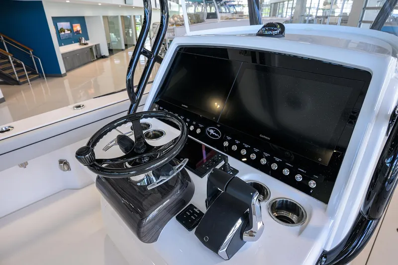 Slide: The Image of 2025 Valhalla Boatworks V-29 helm with modern controls and sleek dashboard design. - 21